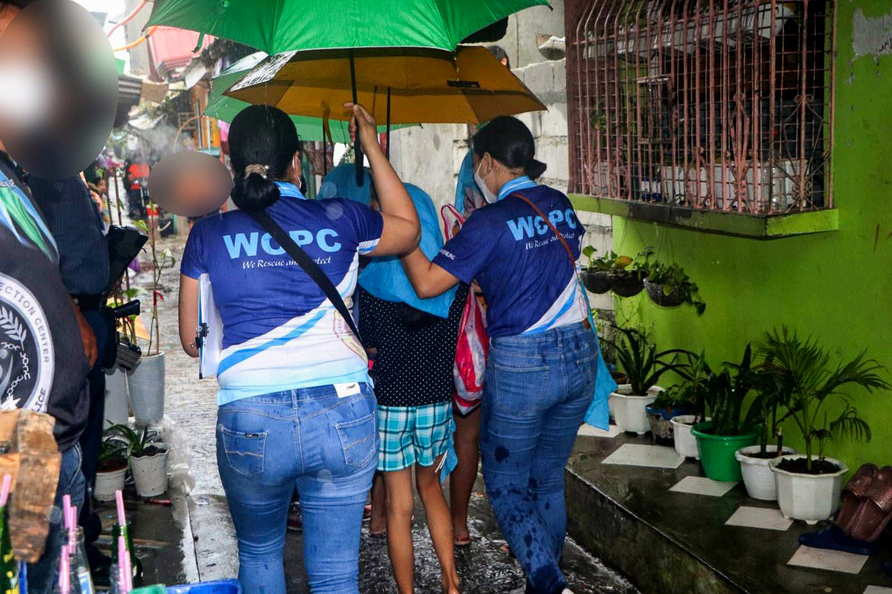 WCPC operatives escort young victims Photo by PNP WCPC